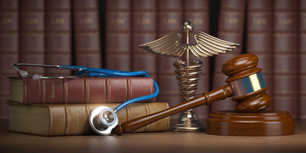 Gavel,,Stethoscope,And,Caduceus,Sign,On,Books,Background.,Medicine,Laws